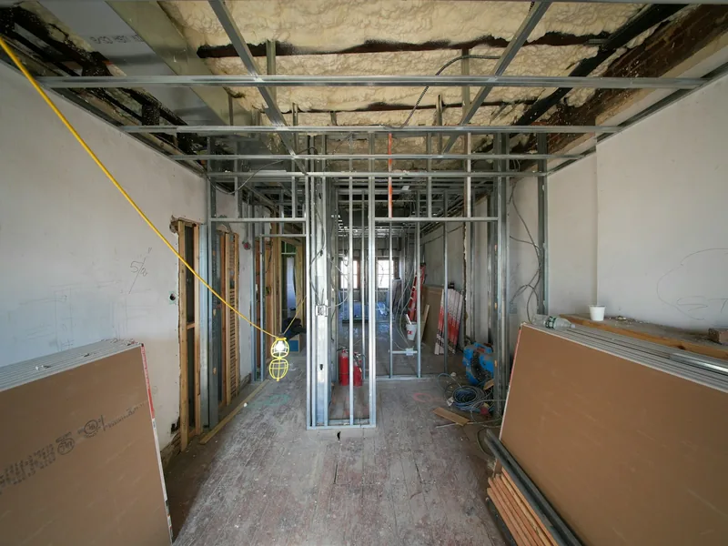 Interior renovation with metal framing and drywall panels