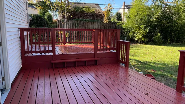Red-painted wood deck with railing