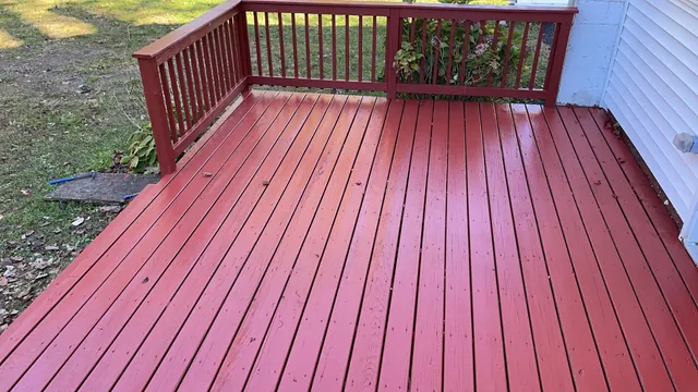 Red-painted deck floor and railing, freshly finished